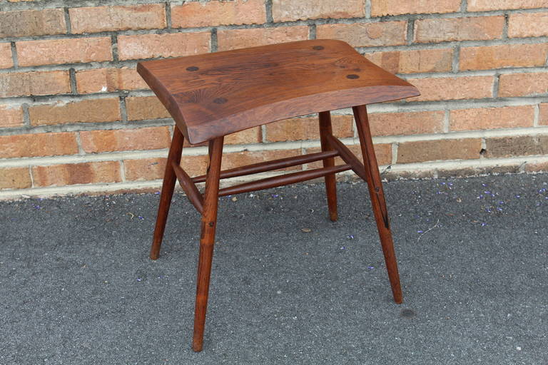 A fantastic rosewood table/stool - A product of the mid 20th c. American studio craft movement. Solid, two board rosewood top, joined together with a spline. Lovely tapered dowel legs. A fine, one-of-a-kind, studio piece. Signed.