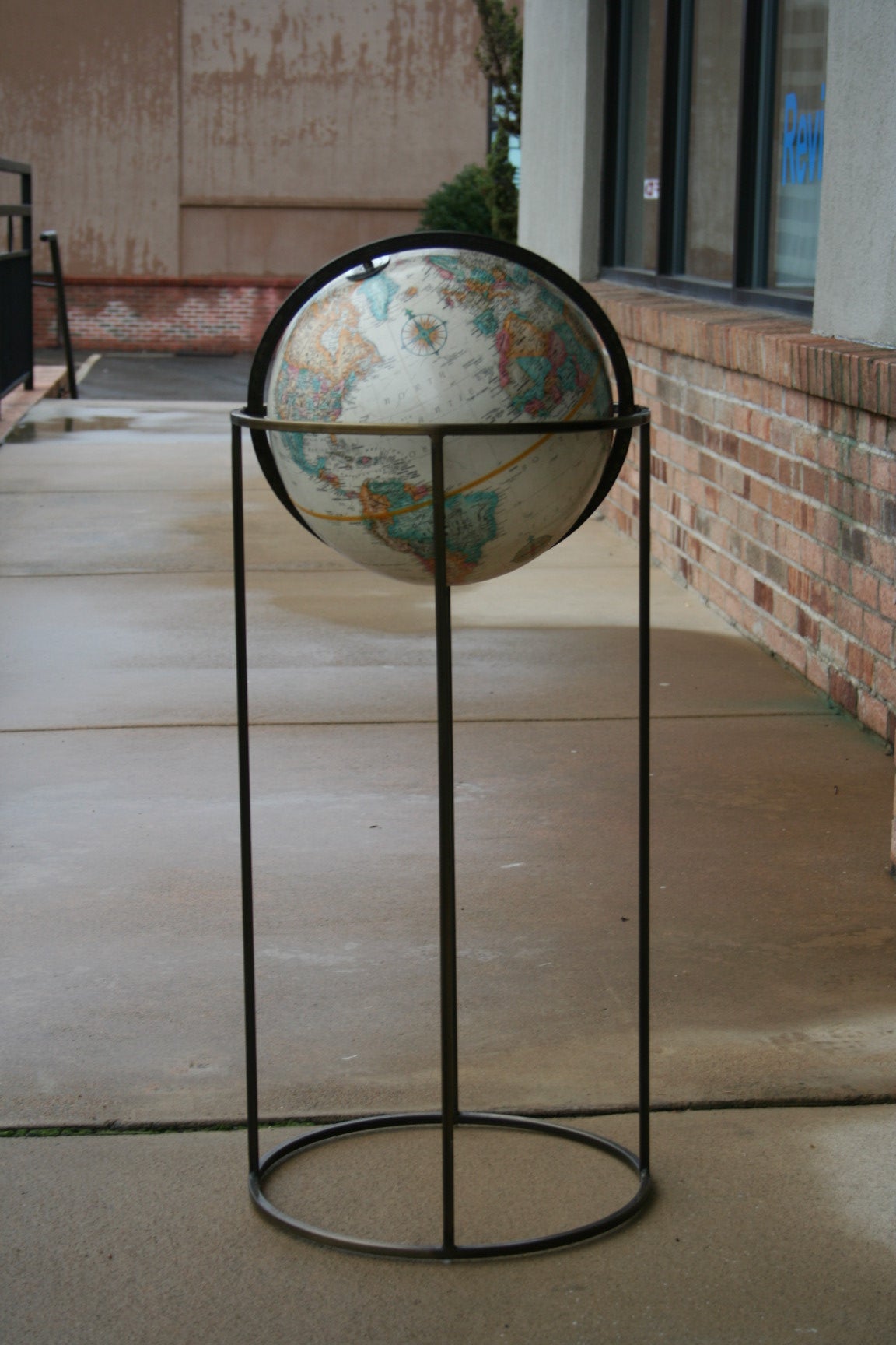 An Elegant Brass Floor Globe
