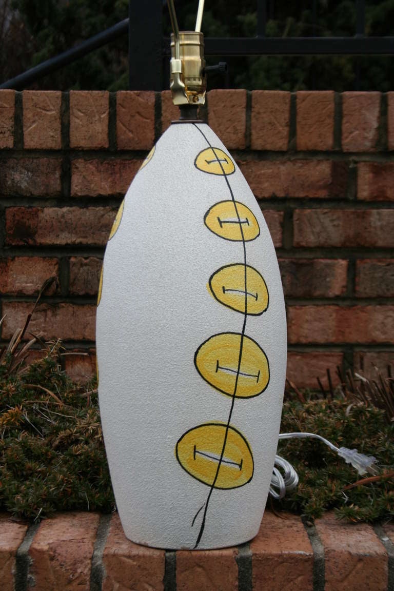 A super fun and unique Italian ceramic table lamp, imported by Raymor. Yellow contrasts very well on the white. Rewired. 
Expedited shipping available. Height to socket. 15