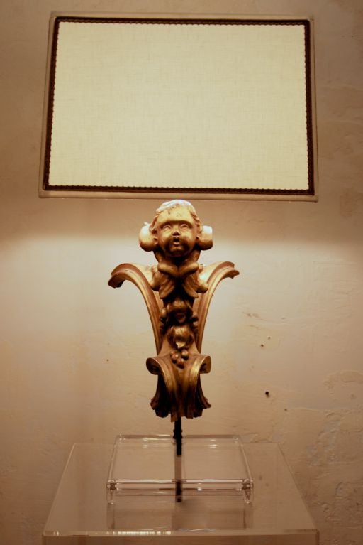 Pair of 19th c water gilt wood cherub lamps.