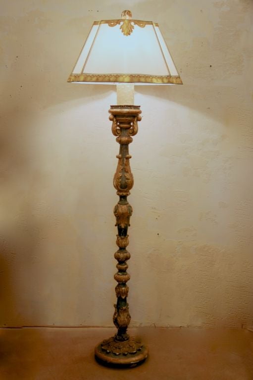 18 th c standing candle stick wired into floorlamp.