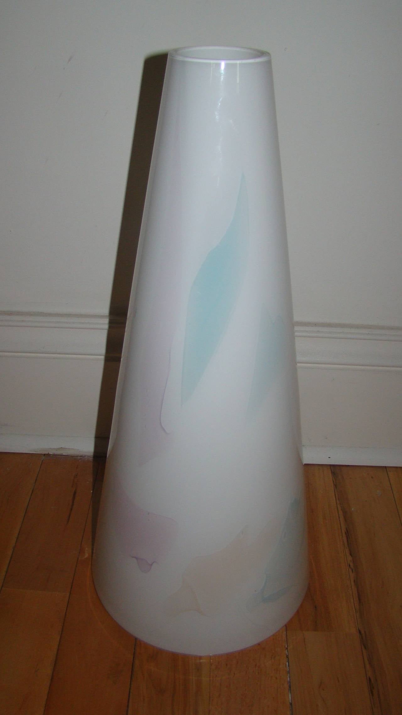 Terrific Mid-Century Murano glass vase. This beautiful piece is comprised of handblown white glass with light abstract colors of purple, blue, pink and peach throughout in an abstract conical form. It was likely retailed by Huff Furniture in the