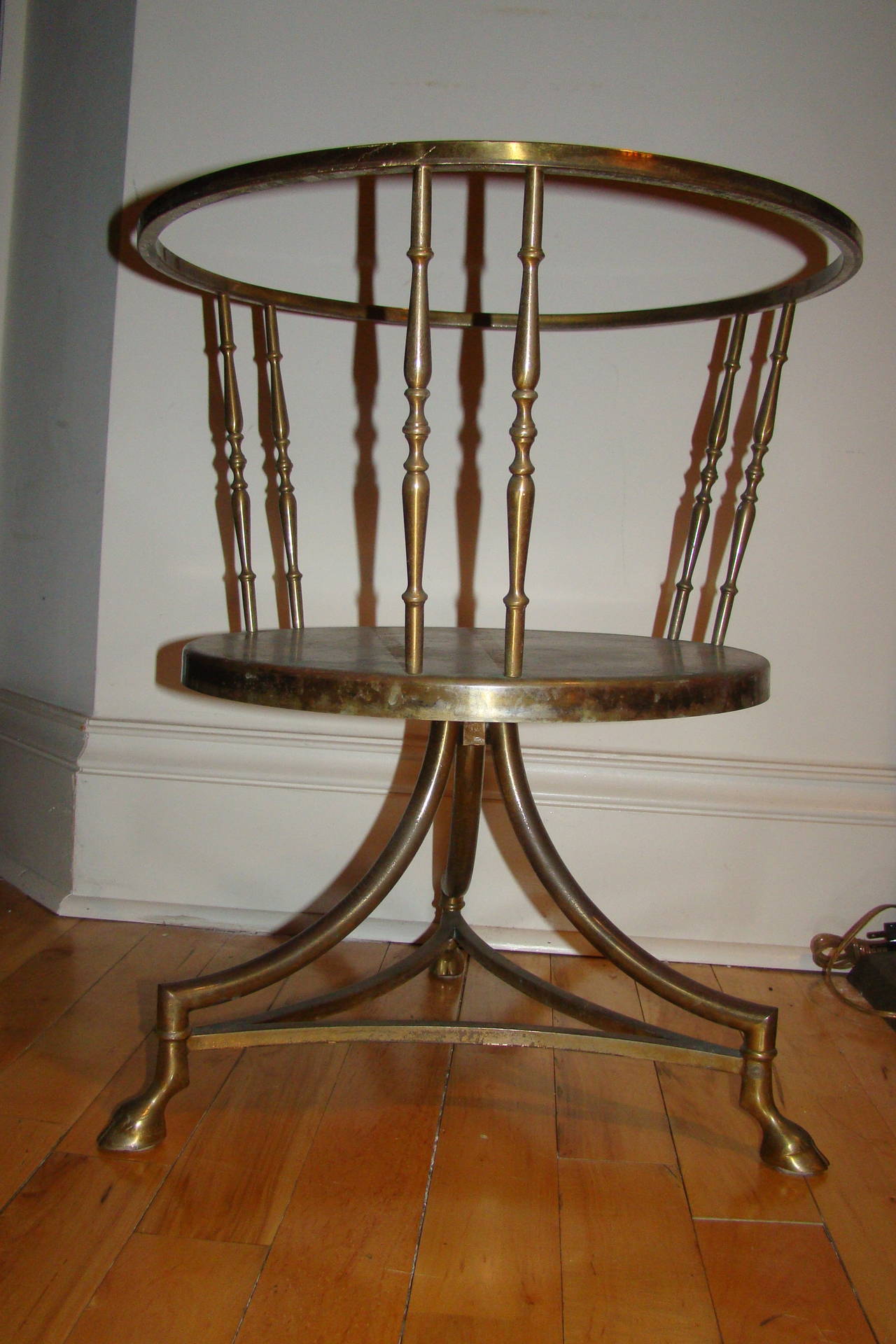 Exceptional Mid-Century Italian Chiavari table. This interesting design is comprised of a sculptural brass frame with hoof foot legs. Glass top not included.