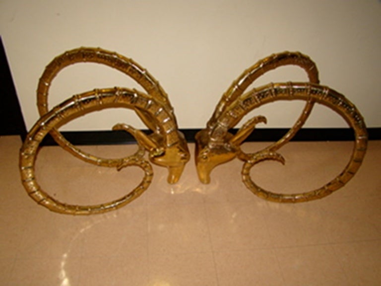 Exceptional Sculptural Solid Brass Gazelle Ibex Dining Table in the manner of Leon Francois Chervet. This beautiful design is comprised of solid brass/bronze in the form of 2 Massive highly detailed Rams Heads. Truly a beautiful design in person!