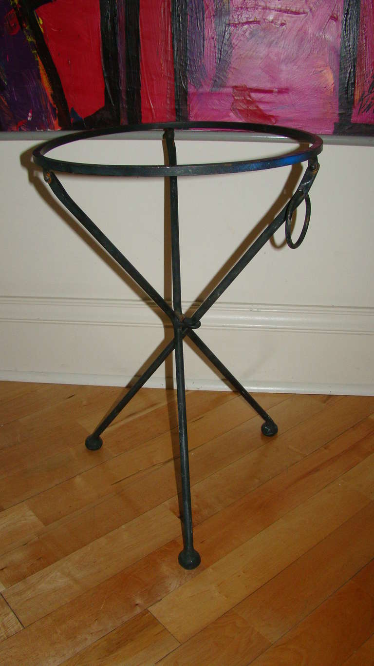 Terrific Mid Century Folding Tripod Table. This interesting design is comprised of solid iron metal and is designed to hold a glass top. (glass not included) Truly a beautiful design in person!