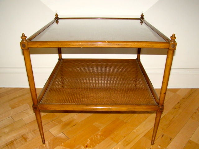 Terrific Nadler of NY Large Occasional or Coffee Table. Comprised of two tiers of woven cane with sculptural tapering leg design. Brass tip feet and brass circular inlay adorn each corner as well as a removable glass top. Truly a beautiful design in