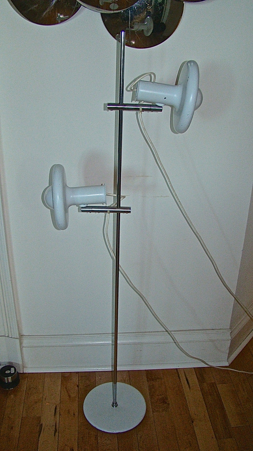 Exceptional Danish modern Mid-Century floor lamp by Fog & Morup. This unique design is comprised of two white enameled metal shades which are adjustable and pivot to position the light in many ways. Signed Fog & Morup made in Denmark.