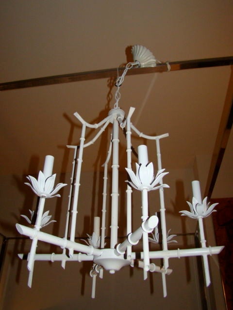 Supurb French Faux Bamboo Pagoda Hanging Chandelier. The lamp is compirsed of a metal faux bamboo frame with 6 arms/bulbs each of which rests in a flower petal style leaf.  Complete with chain & ceiling cap.  Much is the style of Maison Bagues.