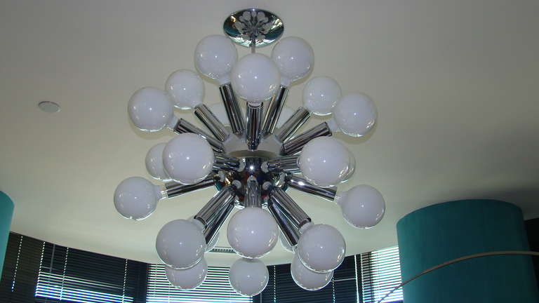 Terrific Big Chrome Sputnik Hanging Chandelier Lamp. This beautiful lamp is comprised of shiny chrome and will fit large globe light bulbs or the smaller versions (no bulbs included). It has approx 24 arms which each take a bulb. Center ball is
