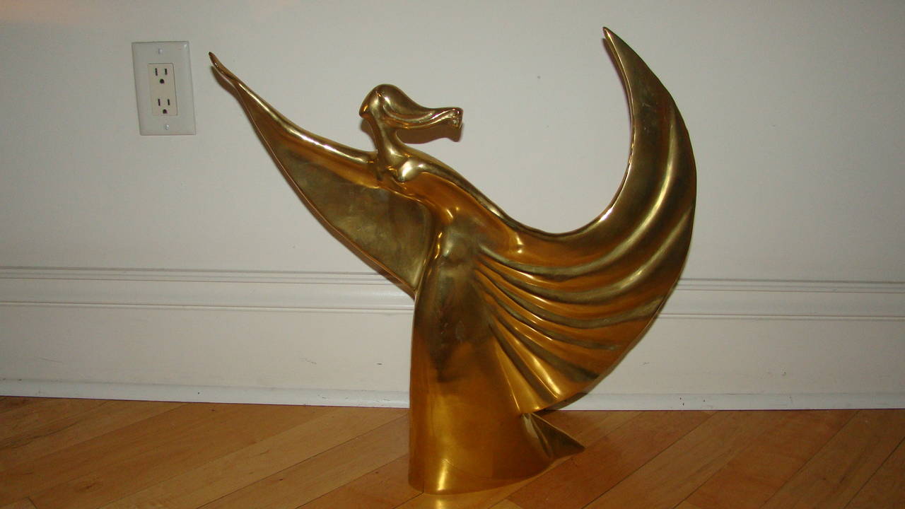 Beautiful large brass Mid-Century butterfly girl sculpture. This unique piece is unsigned, but much in the style of Alain Chervet depicting an Art Deco winged women often called butterfly girls. Truly a terrific sculpture in person.