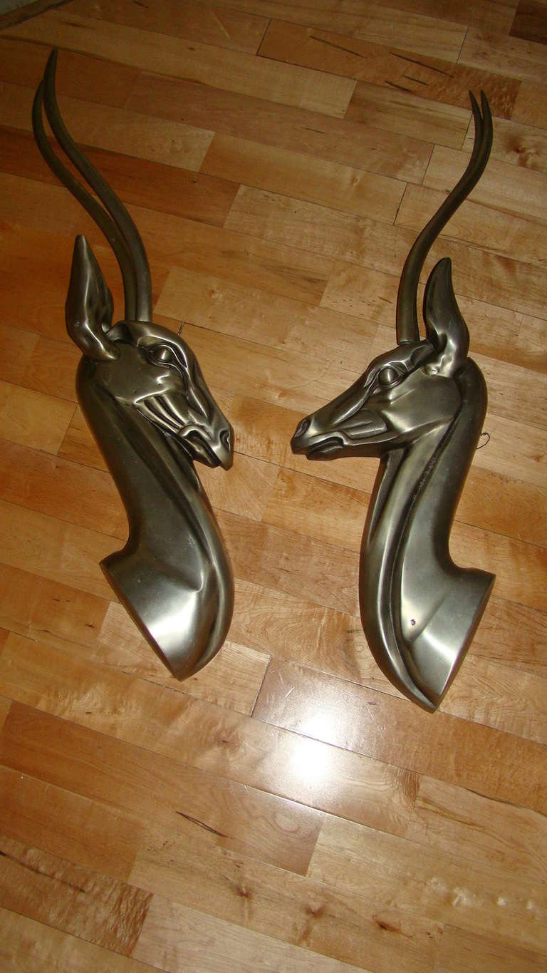 Exceptional pair of Aluminum wall hanging sculptures depicting a male and female Ibex. Each was designed to hang on the wall and are very detailed and well made.