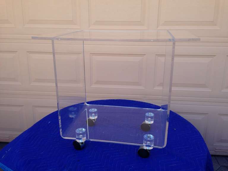 Sculptural Lucite Mid Century bar cart. Perfect for serving or display.
