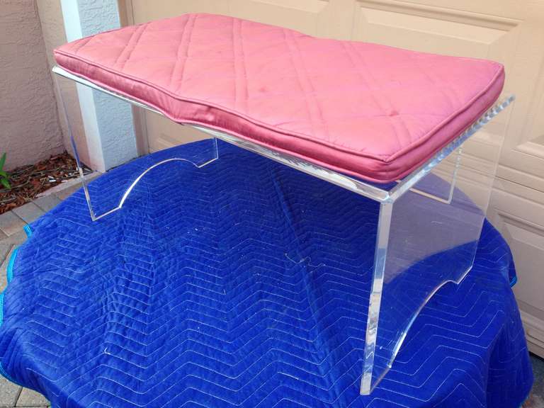 Thick Mid Century Lucite Bench. Pink cushion is removable or it can be used as a table.