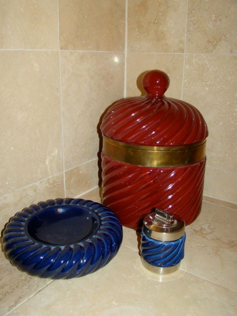 Italian Ceramic Ice Bucket & Ashtray/Lighter set designed by Tommaso Barbi. This unique set is constructed of glazed pottery with brass & chrome accents. Price is for all 3 pieces.