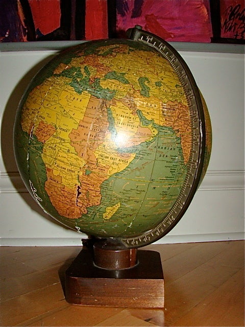 Terrific Art Deco Lighted Glass Terrestrial World Globe by Crams. This interesting globe is comprised of a glass frame with unique original sculptural wood base.