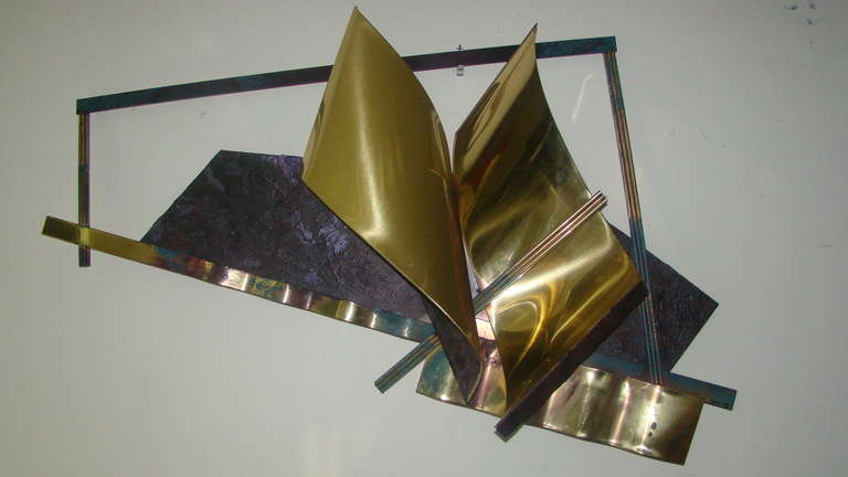 Terrific Abstract Wall Hanging Brass Sculpture by Curtis Jere 1982. Comprised of sculpted welded brass with original green and purple post modern painted finish.