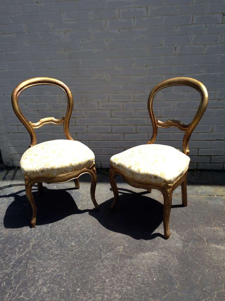 Great pair of gold gilded Victorian wood chairs with Balloon back.