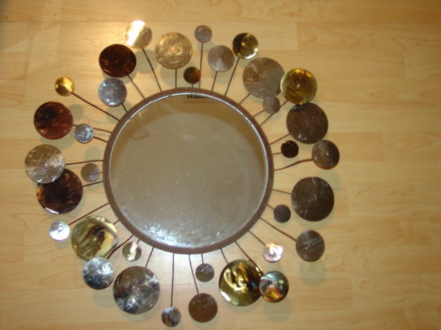 Curtis Jere metal sculpture raindrops mirror. Good condition. Metal discs bursting out from round mirror.