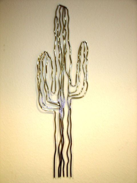 Large scale life size tubular chrome metal wall sculpture in the form of a cactus by listed artist C Jere.