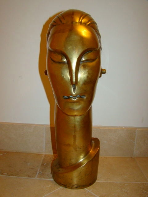 Beautiful streamline Art Deco sculpture. Comprised of brass or bronze with fine patina throughout.