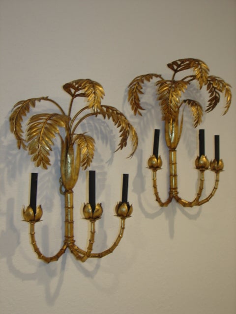 Gorgeous large scale pair of palm tree wall sconce lamps with faux bamboo accents.