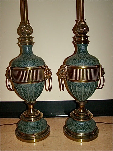 Glamorous Pair of Stiffel Table Lamps. This interesting pair of lamps are each comprised of a Verdigris (Green) body  with brass accents and Lion door knocker style design. Complete with glass difusers. Truly a beautiful pair of lamps in person!