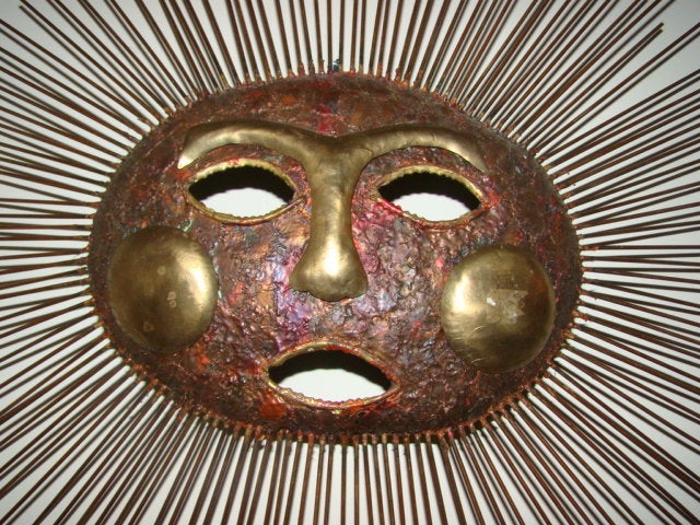 Exceptional Wall Hanging Sun Face Sculpture/Sconce. This interesting design is constructed of hand welded rods with whimsical face. There is a socket behind it which iluminates the face when lit. Very unique in person! Signed C Jere 69.