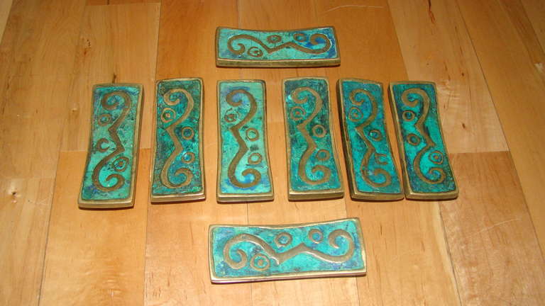 Exceptional set of 8 Matching Sculptural Drawer pulls by Mexican master Pepe Mendoza. Comprised of solid bronze with inlaid Green Sodalite/Ceramic material. Each signed Mendoza.