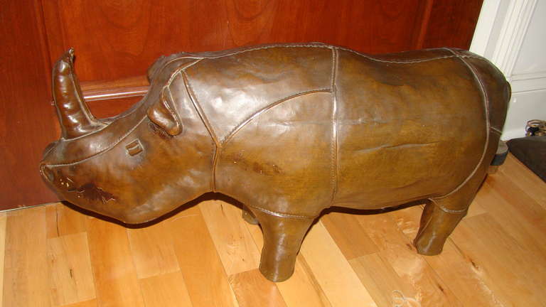 Exceptional and hard to find pottery rhino sculpture designed by Dimitri Omersa and used as display in Abercrombie & Fitch stores. Constructed of a heavy pottery made to look like the leather animals in every detail.