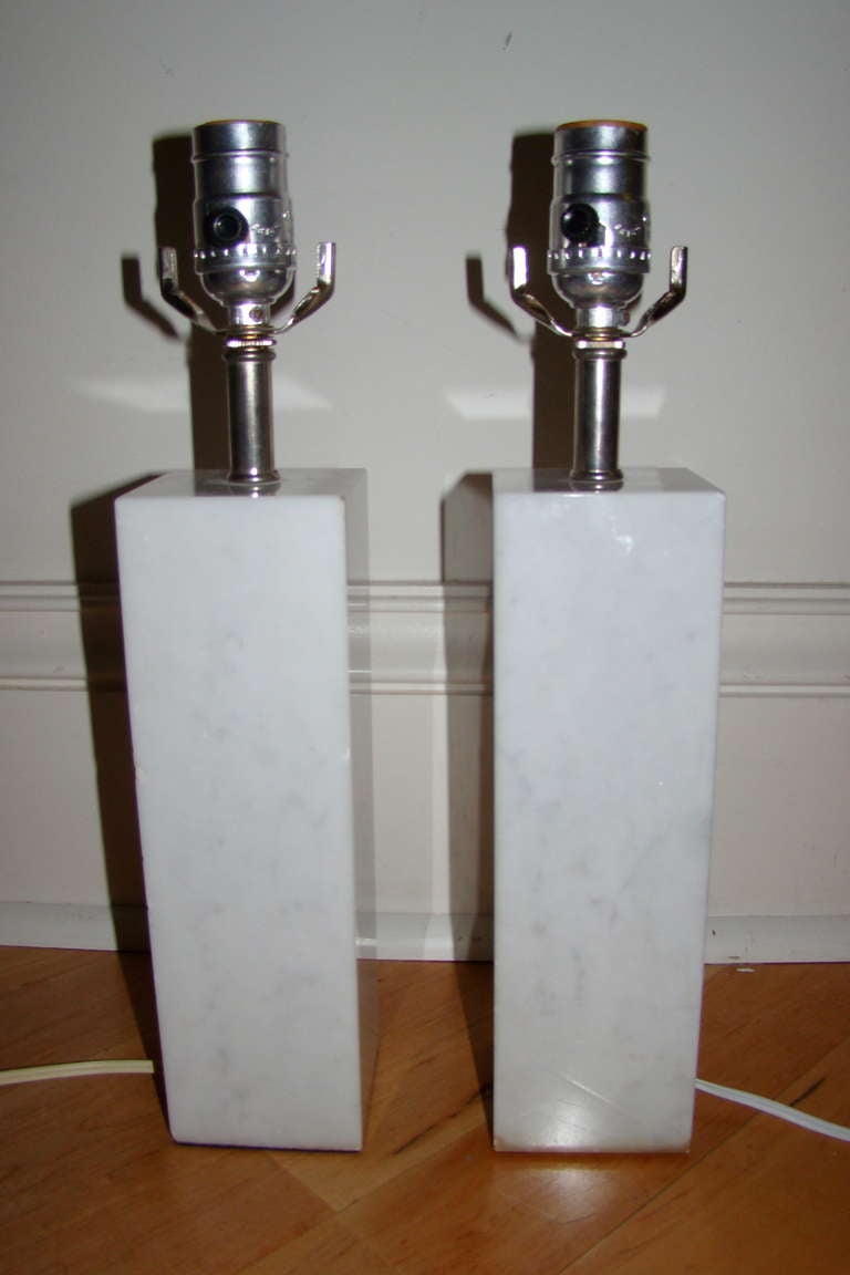 Pair of Italian Carrara Marble Table Lamps. Comprised of grey vein Carrara Marble Cube bases with chrome hardware.