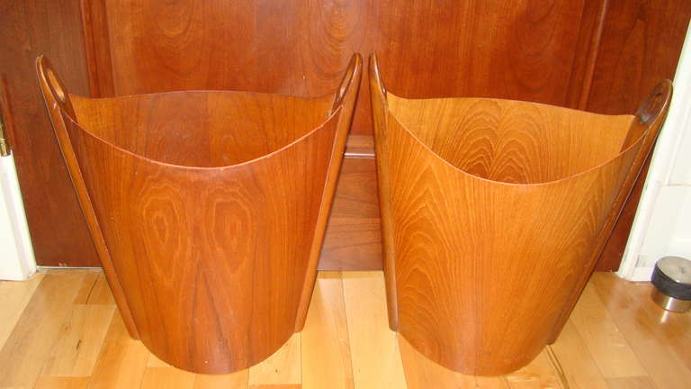 Beautiful pair of Sculptural Waste Baskets designed by Einar Barnes for P.S. Heggen, Norway. Each are comprised of teak veneers. These are often used as umbrella stands or stacked as sculptures as well.
