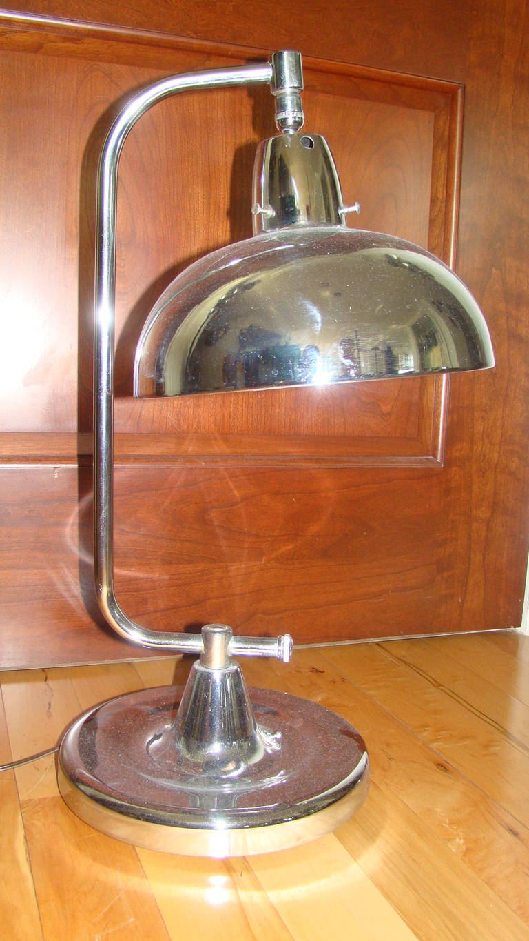 Terrific Vintage Chrome Jewelers Desk Lamp by Apollo Chicago. Comprised of a shiny chrome frame with adjustable shade and extra bright Jewelers Bulb.