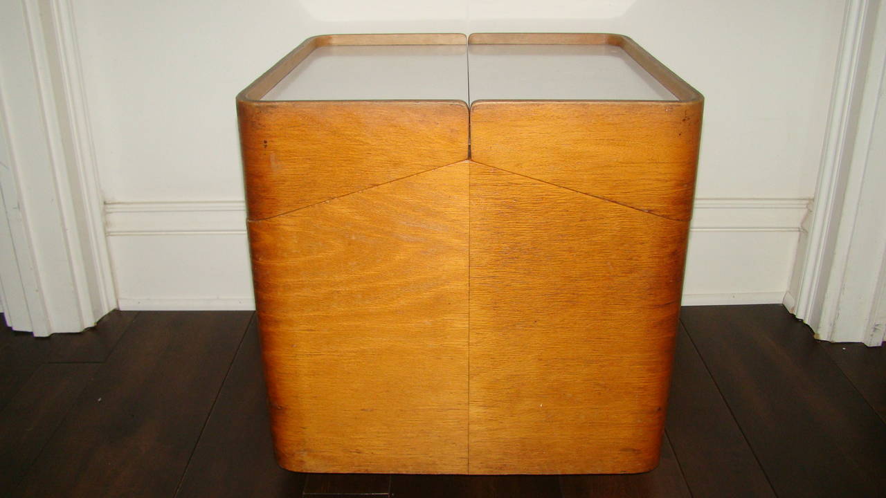 Terrific Mid-Century Scandinavian rolling sewing / storage cube table. This unusual piece is comprised of a wood frame with laminate tops which open up to reveal a drawer and interior storage area. Extremely well-made design. We believe its original