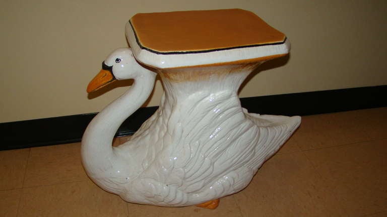 Beautiful Italian Garden Table/Stool in the form of a graceful swan. Hand painted with colors of orange,black and white. Very heavy and solid made for outdoor or indoor use. Signed made in Italy.