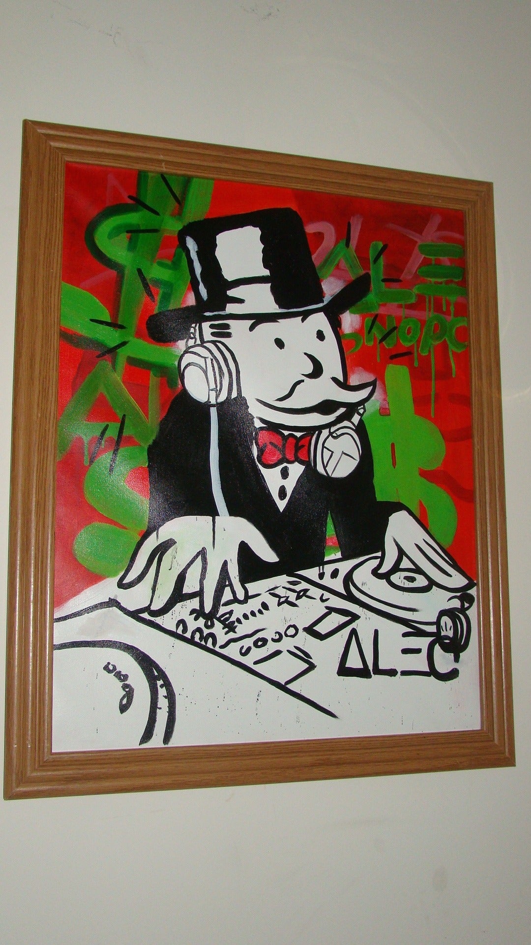 Exceptional Original Alec Monopoly Painting. This interesting painting depicts a DJ Monopoly Man. Signed Alec on the front and back and dated 2014. Truly a beautiful piece in person.