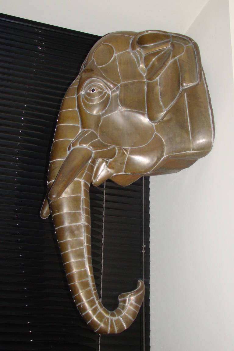 Exceptional and large mixed metals elephant wall hanging sculpture by Sergio Bustamante, signed and numbered. Comprised of welded brass with glass eyes.