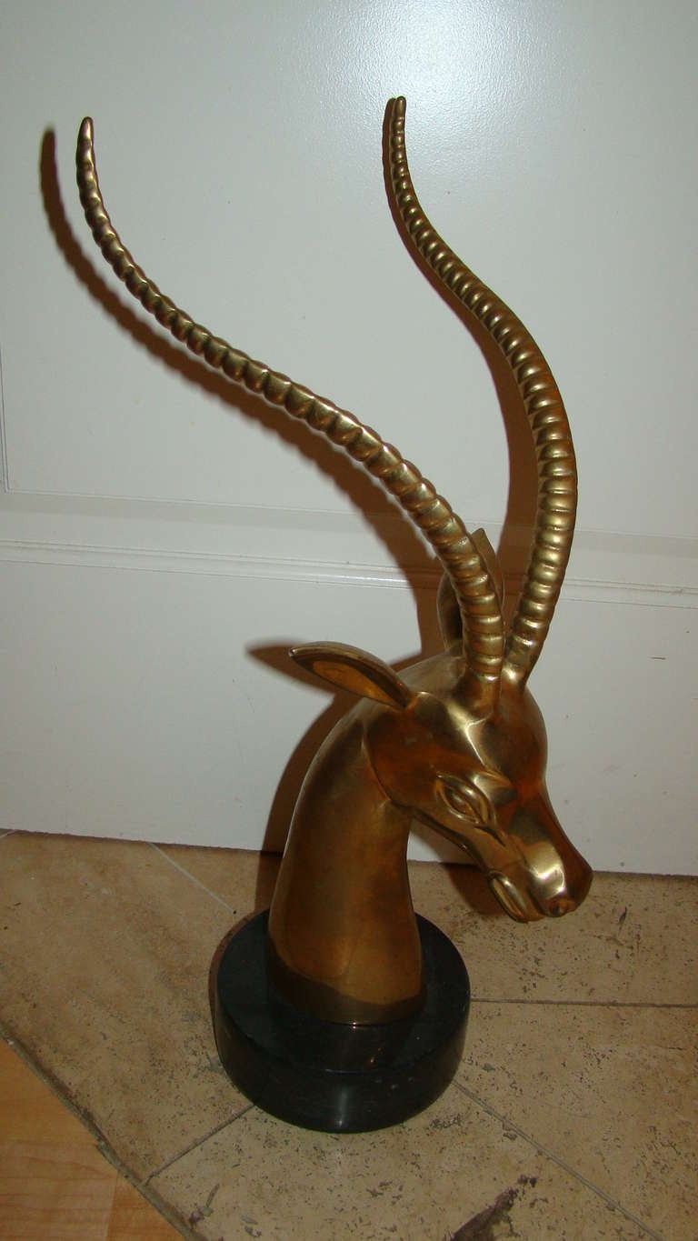 Exceptional Mid Century Solid Brass Ibex Table Sculpture. This interesting piece is comprised of polished brass with heavy marble base. Truly a beautiful piece in person!