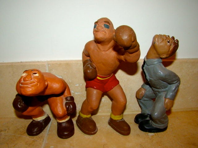Whimsical set of 3 boxing sculptures by L.L. Rittgers signed and dated 1944. Each piece is constructed of a hand painted chalkware material. Price is for the set.