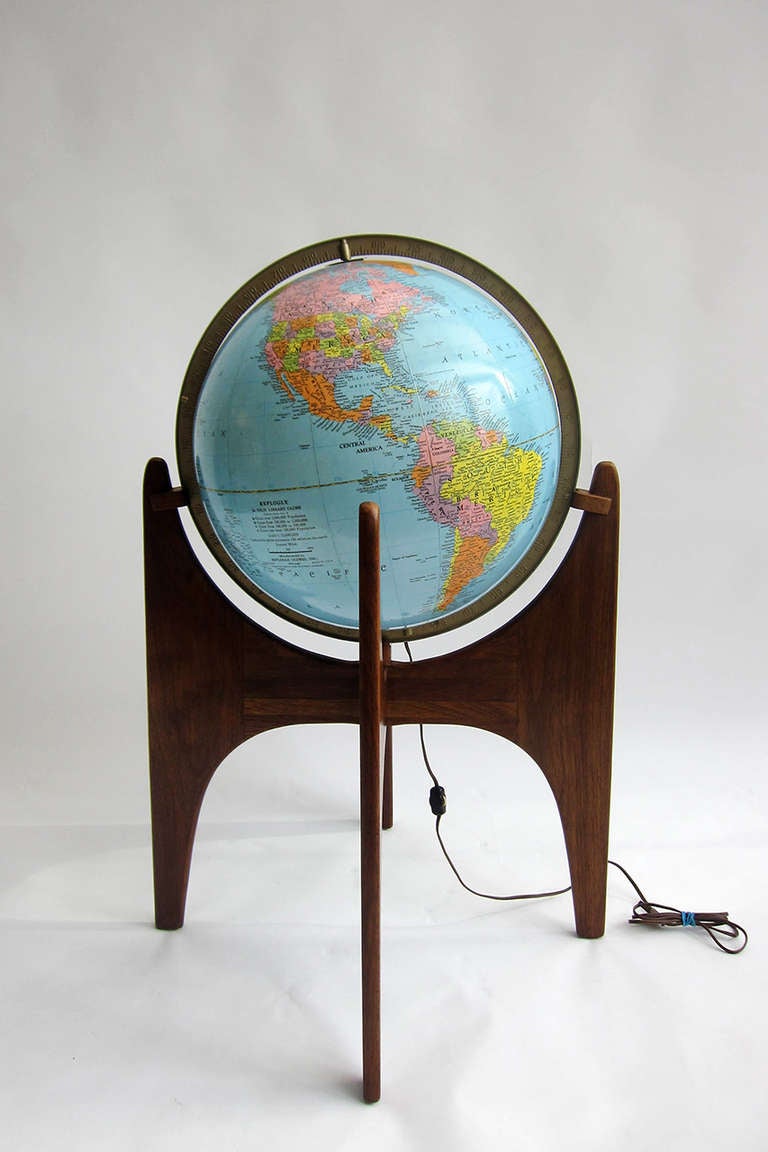 This Replogle globe from the 1960’s rests in a beautifully crafted walnut stand by renown American designer Adrian  Pearsall (1925-2011). 2 years after receiving a degree in architectural engineering, Pearsall founded Craft Associates and would