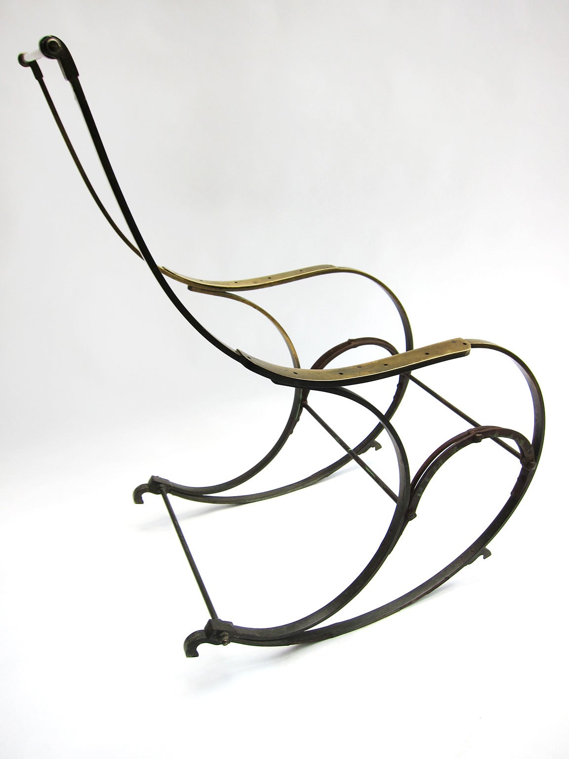 The innovation and mastery of this exceptionally sculptural rocking chair should be taken in the context of the era in which it was created. Featured by R.W. Winfield in the Great Exhibition of London in 1851, it was meant to demonstrate a