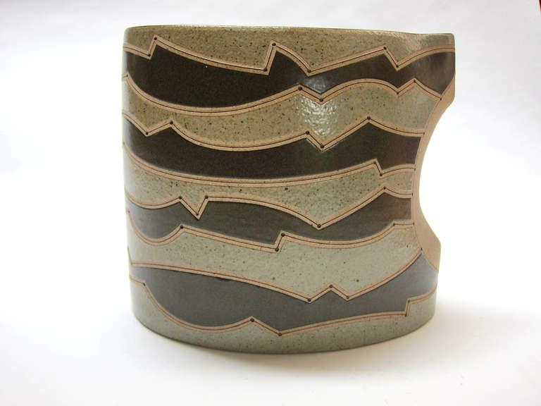 Hand thrown, incised, glazed ceramic vessel, number 166, by Gustavo Perez. (The high-temperature stoneware clay body is usually fired above 1200 degrees centigrade at which point it becomes vitrified).
Born in 1950, in Mexico City, achieving his