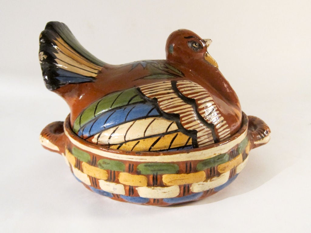 This hand formed vintage piece of pottery from the centuries old pottery center of Tlaquepaque, Jalisco, is very atypical of this type casserole from that era. Its size, coloring and form make it a very nice example of Mexican folk art of the early