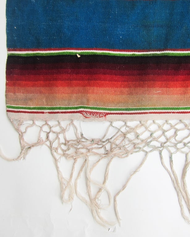 Woven in a single width (of 58â??), this serape of hand dyed wool was made especially for Luis J. Lopez in the 20â??s, in the post classic period between 1850 and the early 20th C. It beautifully displays the 8 tones of each color used (a