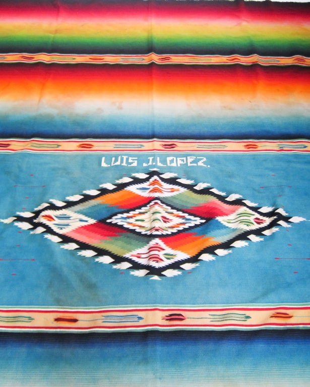 From the same home as the other serape shown on the storefront, this serape displays an extraordinary array of colors, all meeting at the rumbo of softer colors.  It is a wonderful example of the quality and superb craft of the Saltillo weaver. 