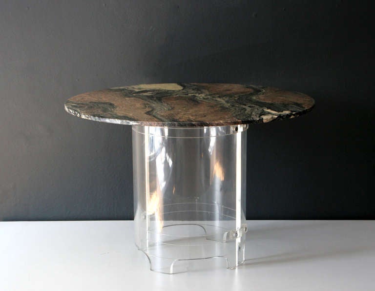 Round  green marble table with an acrylic base