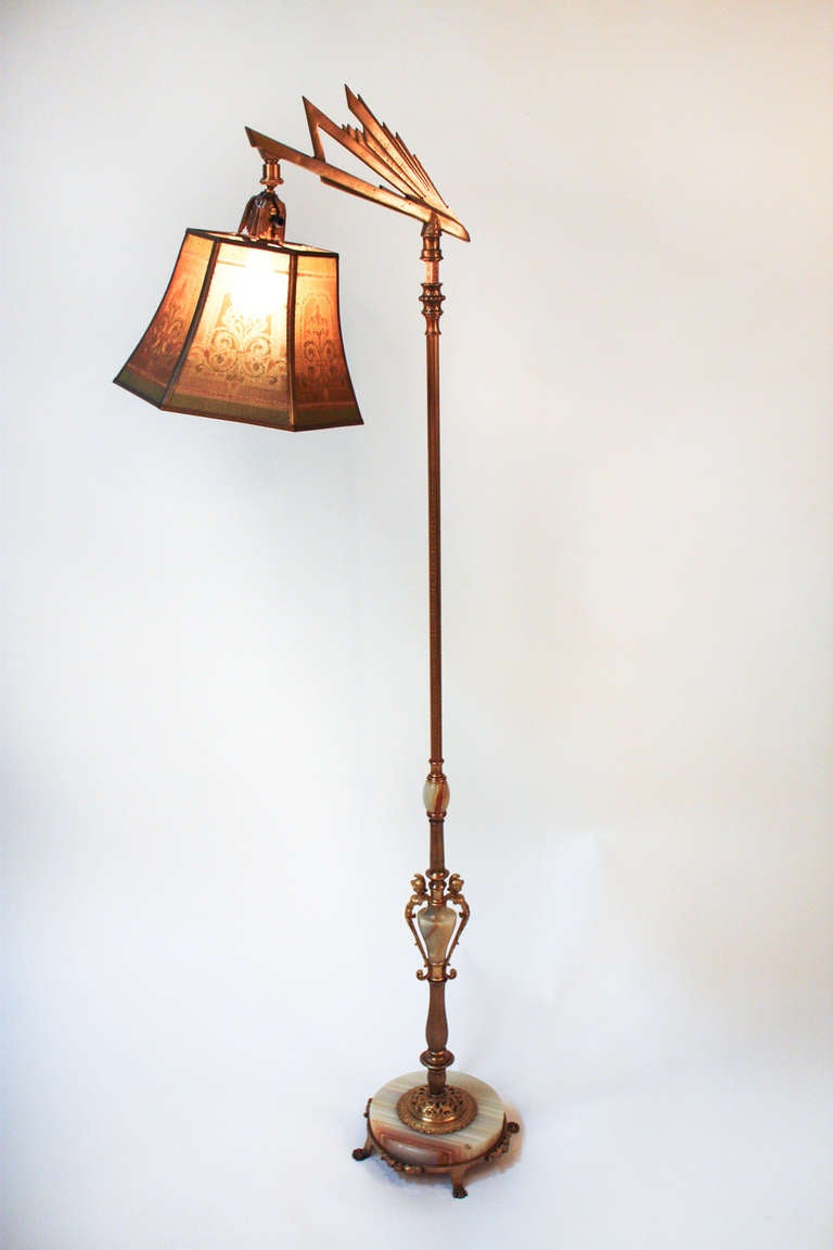 A classic piece of Americana, this beautiful Art Deco bridge floor lamp includes the original painted metal shade. Truly beautiful.