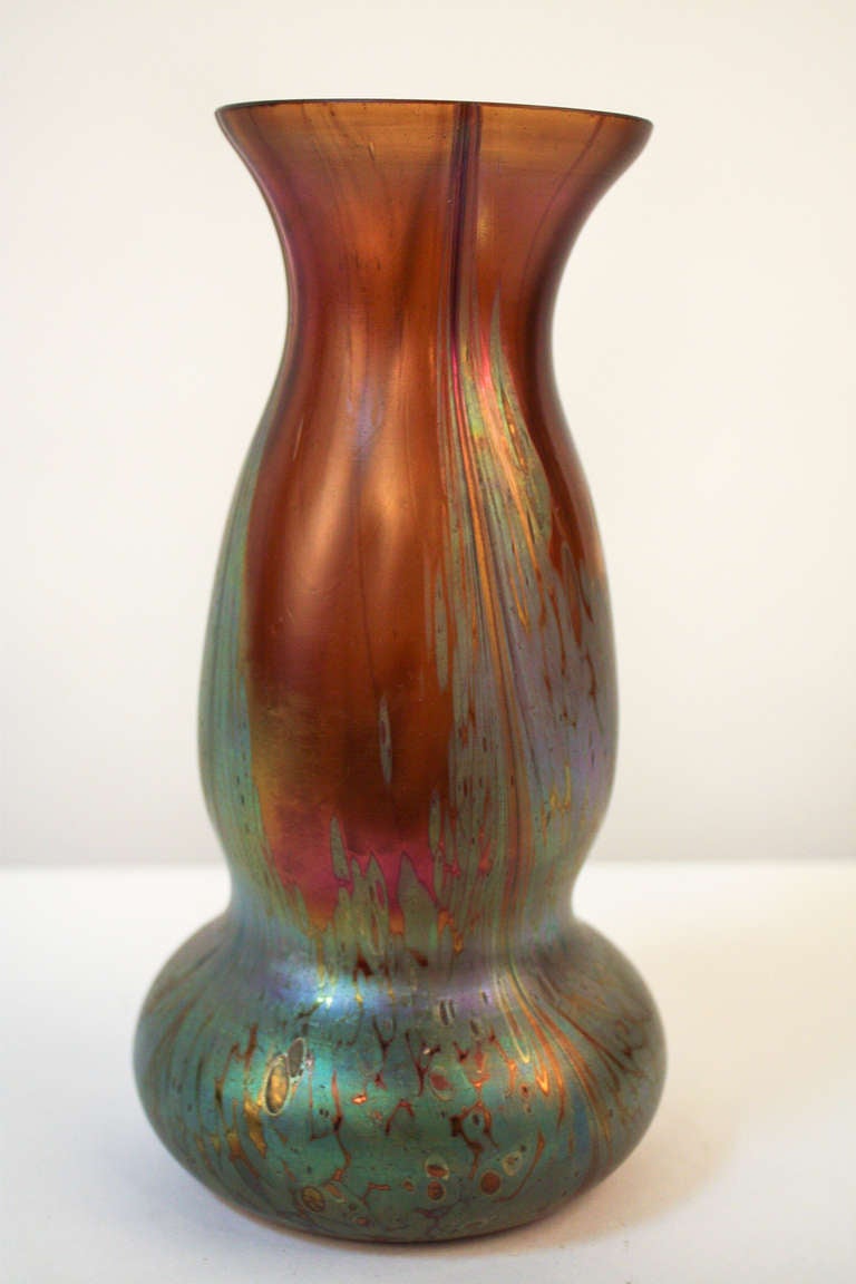 A beautiful bohemian art glass vase. Made by the world renowned Loetz glassmakers in the Czech Republic, this stunning vase features a spectacular multicolored glass. This is a great piece, as beautiful today as it was a century ago.