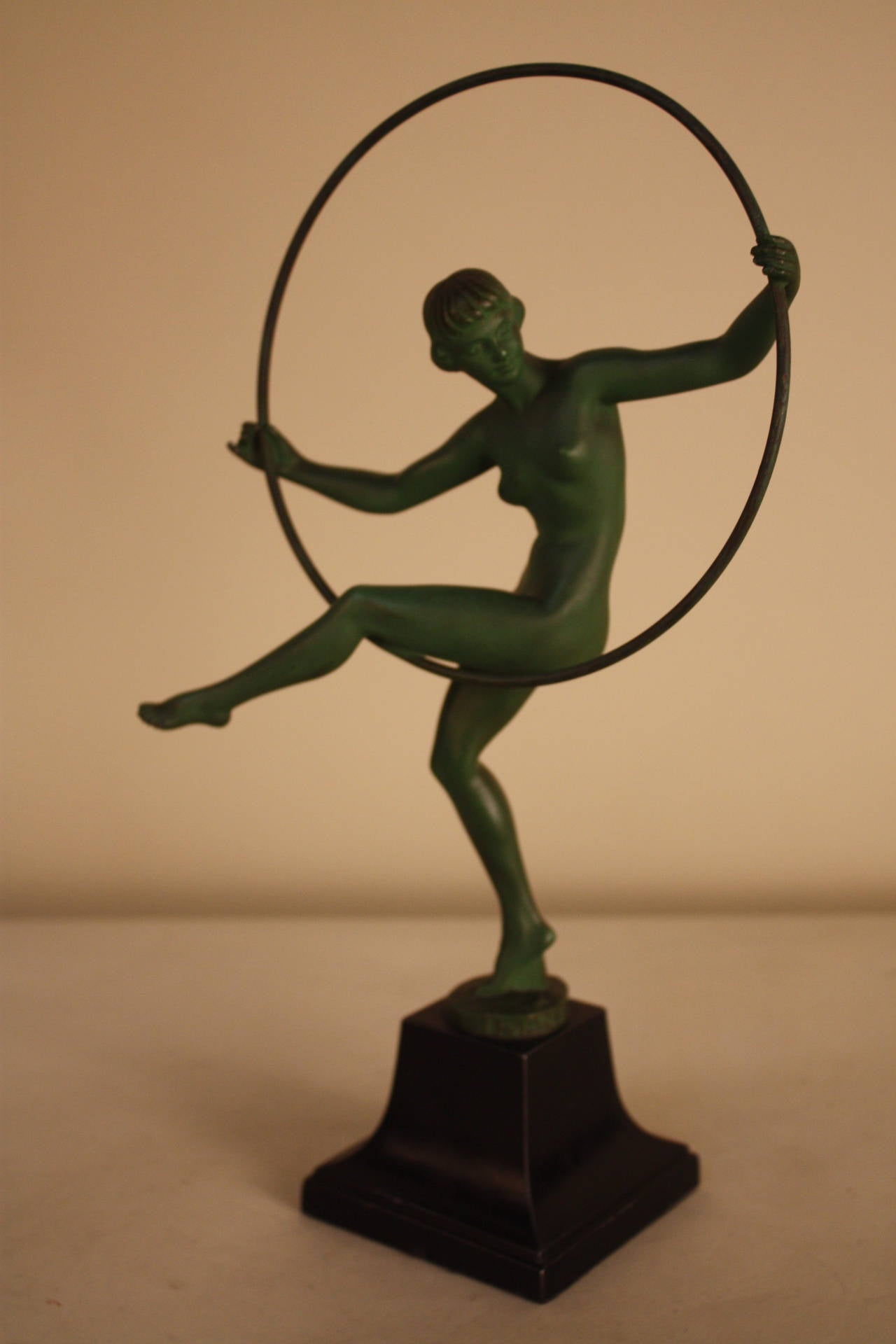 Delightful French Art Deco hoop dancer statue, circa 1920s from the Max Le Verrier Foundry and signed Briand.