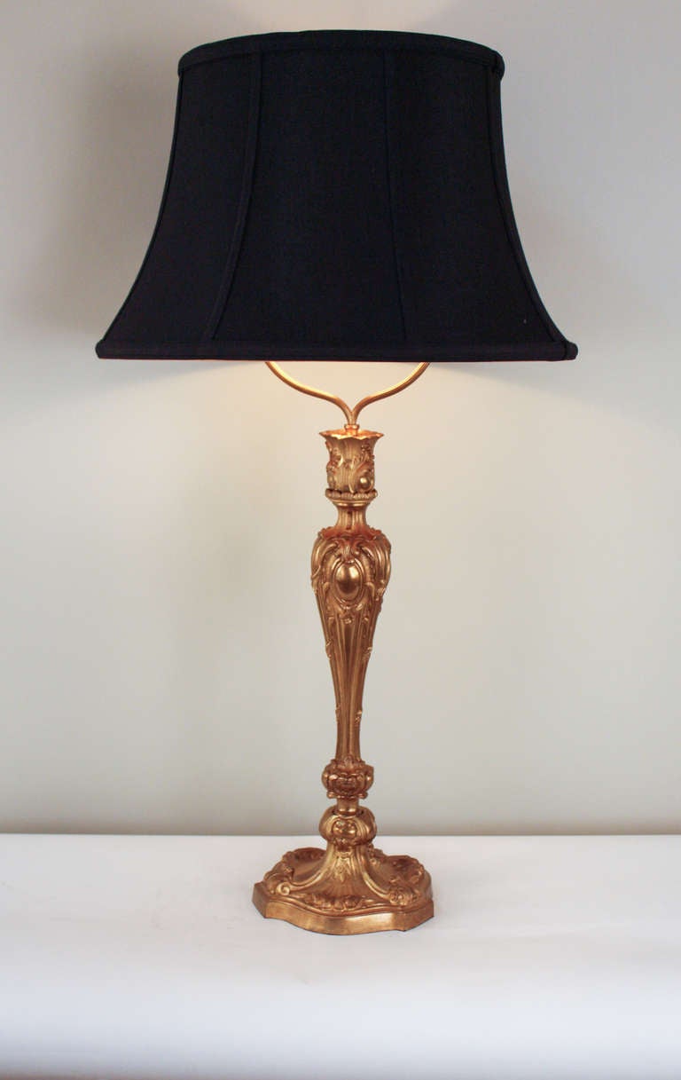A beautiful table lamp from France made of solid bronze. A hand crafted piece filled with ornate detail; this lamp is truly elegant. 

This single socket lamp features a high low switch on the chord for easy adjustment.