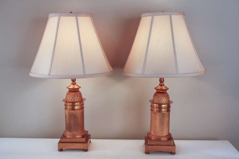 Made in France during the 1800's, these stunning 19th century bronze doré table lamps originally served as candelabra bases. They have been lovingly custom converted and electrified. Beautiful detail work abounds throughout the pair; an excellent